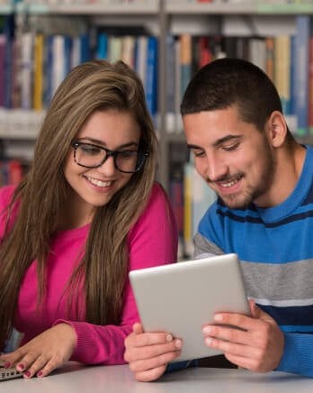 1_Couple-of-Students-At-Library