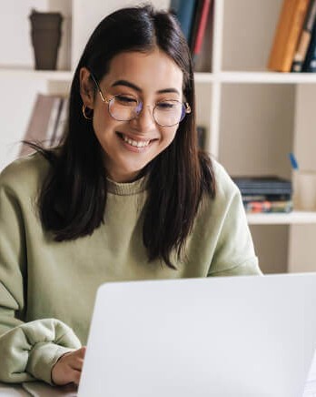 1_Happy-Young-Woman-Using-Laptop