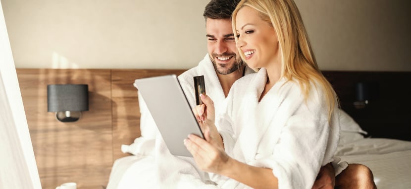 Happy-couple-making-online-reservations-jpg