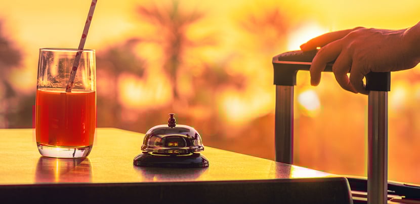 woman-checking-in-tropical-hotel
