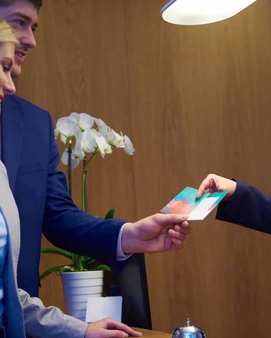 Couple on a business trip doing check