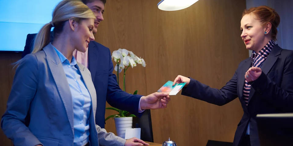 Couple on a business trip doing check