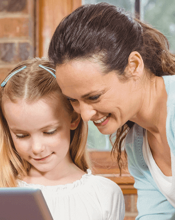 Librarian-Helping-Young-Child-On-Tablet