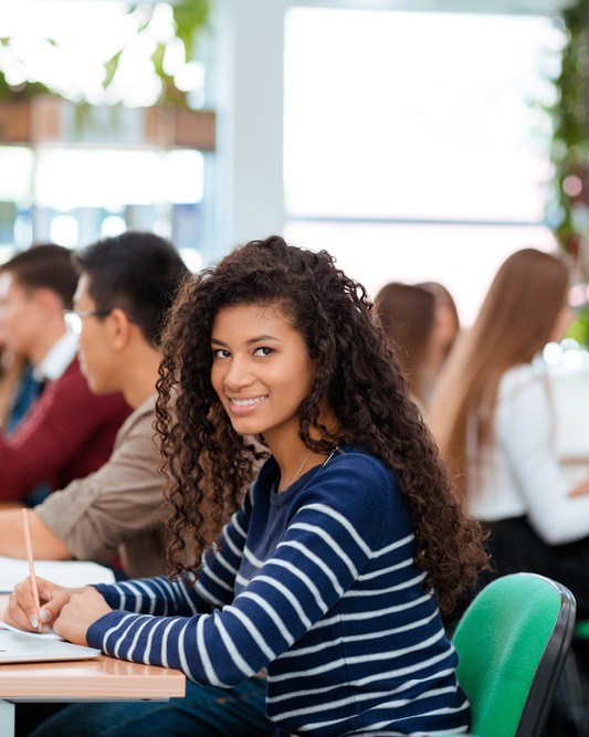 Portrait of a students studying in university library
