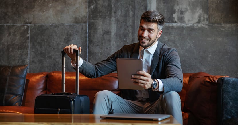 business-man-checking-into-hotel