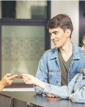 hotel-guests-checking-in-front-desk
