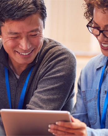 man-and-woman-reading-on-tablet