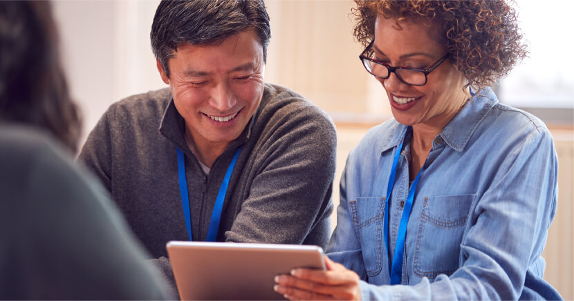 man-and-woman-reading-on-tablet