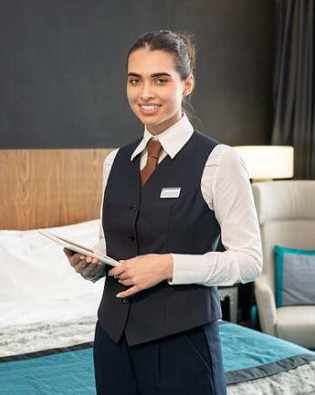 smiling-hotel-worker-in-luxury-suite