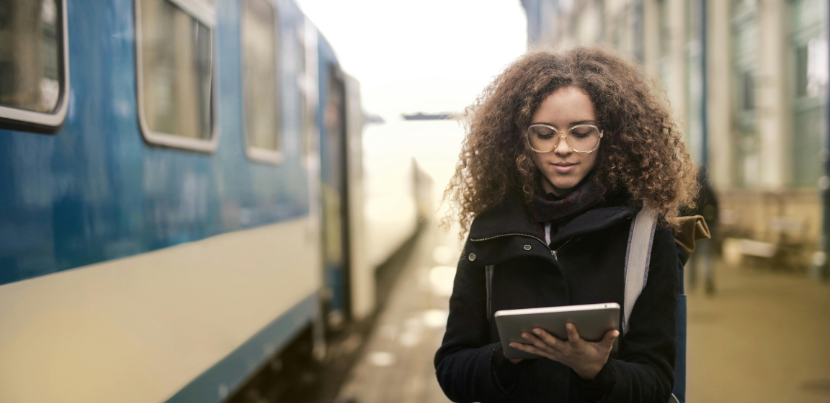 woman-with-tablet-on-train-platform