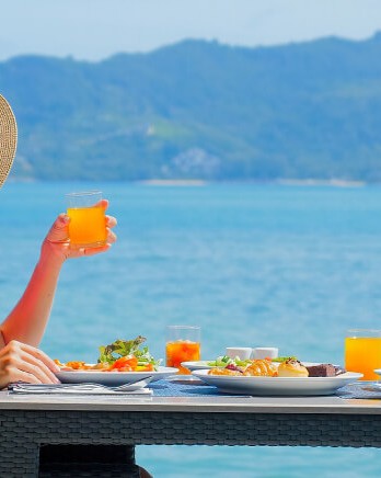 young-woman-in-luxury-resort-having-breakfast